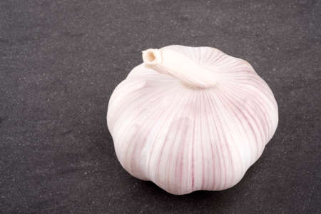 Fresh garlic on stone table