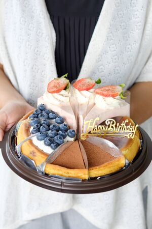 Woman holding mix cake