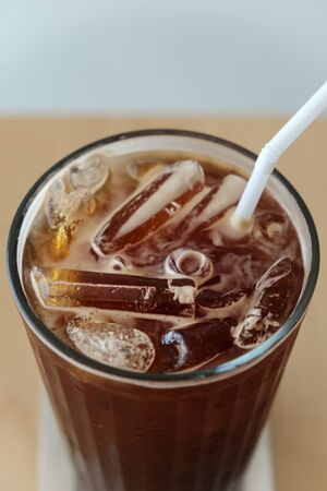 Iced black coffee in cup, close up の写真素材