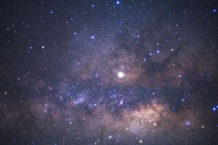 The center of the milky way galaxy with stars and space dust in the universe, Long exposure photograph, with grainの写真素材