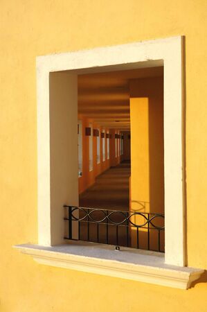 Hallway through a window in Mexico at sunsetの写真素材