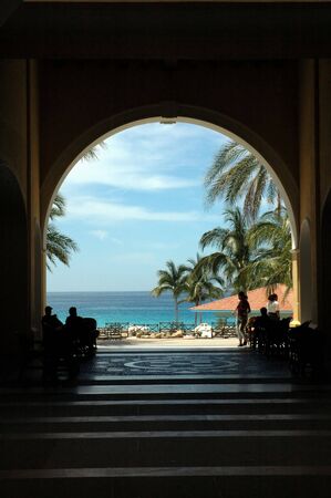 View of ocean through archwayの写真素材