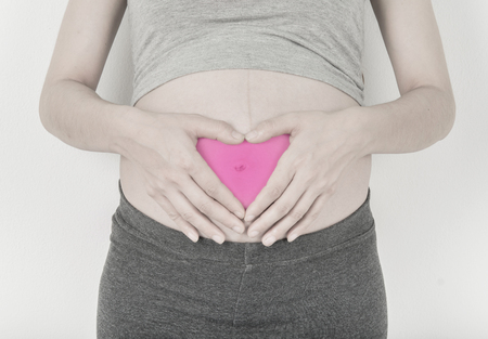 Pregnant and heart symbol hand