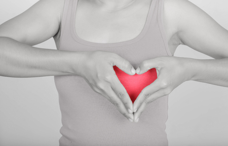 Symbol hand with heart woman and Pink shirtの写真素材