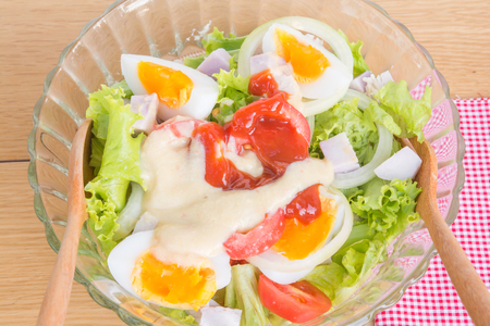 Salad of vegetables and fruits in a glass bowlの写真素材