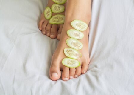 Cucumber and skin treatment and feetの写真素材