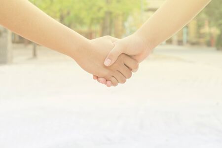 Two hands touching, the meaning of cooperation.の写真素材