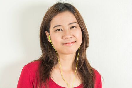 healthy teen listening music from in phoneの写真素材