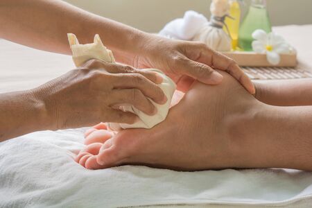 Massage ball on foot Massage therapy to relieve aches and pains.の写真素材