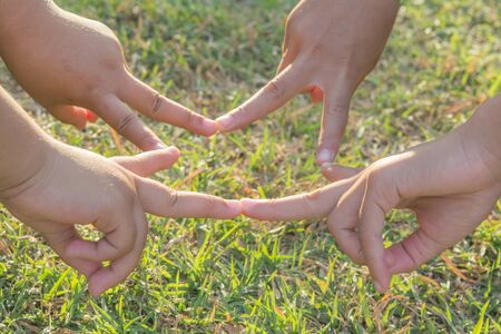 Join hands Sporting local children on playgroundの写真素材