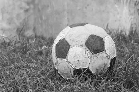 old football black and white on grassの写真素材
