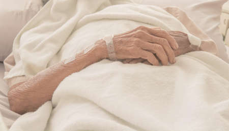 old Hand women on bed patient