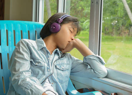 Teenagers listening to music and relaxingの写真素材