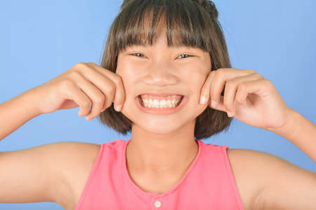 Asian Cute teen on blue background