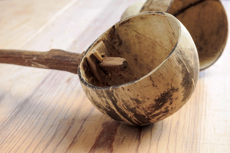 Dipper made from coconut shell, traditional container for drinking water of Thai peopleの写真素材