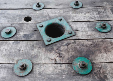 vintage green bolt on vintage woodの写真素材