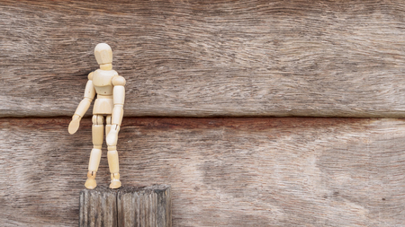 Alone wood man stand on wood backgroundの写真素材