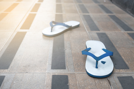 Vintage sandals on the sidewalkの写真素材