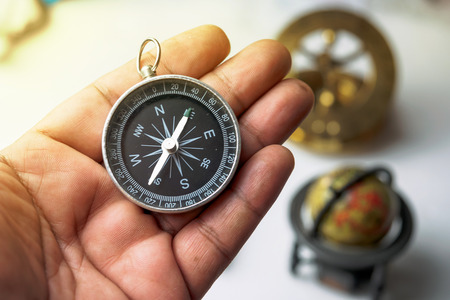 Vintage compass in handの写真素材