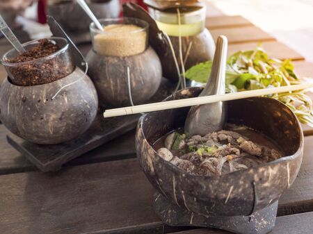 Fine Cut White Rice beef Noodles in Thicken Soup Served with coconut shell,Thai traditional food