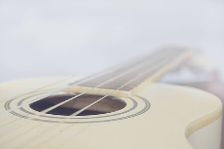 soft focus of white ukulele for background