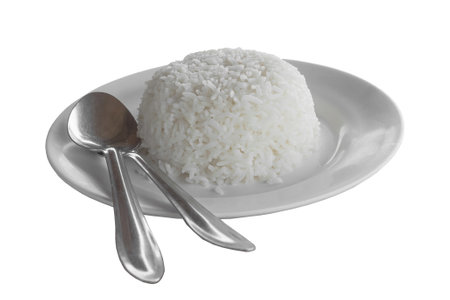 cooked rice fork and spoon in white dish . soft and selective focusの写真素材