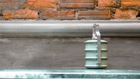 Tiffin, ancient food container, placed on a stone tableの写真素材