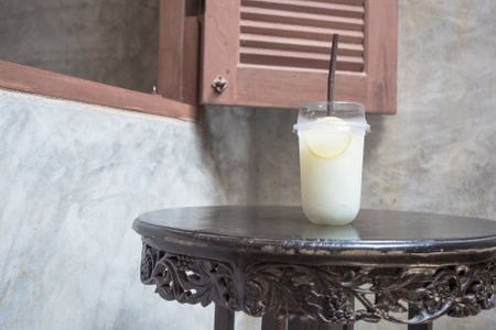 Lemonade Smoothie on wooden table in retro style.
