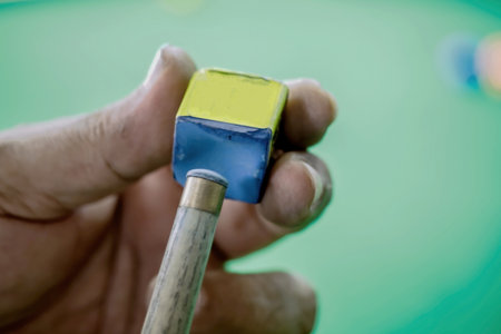 Close up of snooker is chalking cue. Concept of playing activity,の写真素材