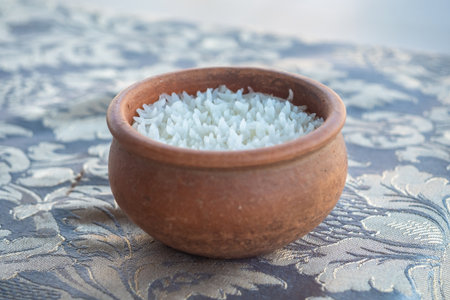 Steamed rice in a clay pot on the dining tableの写真素材