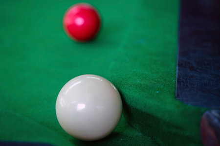 The white ball is behind the curve of the right-corner pocket.
