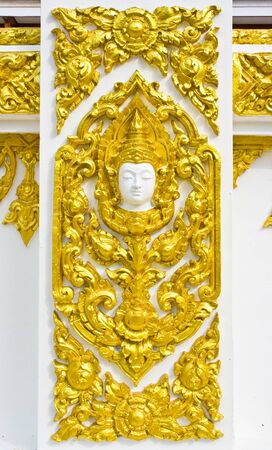 Statue about religion on the wall, Thai temple の写真素材