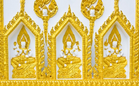 Statue about religion on the wall, Thai temple の写真素材