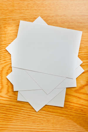 White paper on wood table の写真素材
