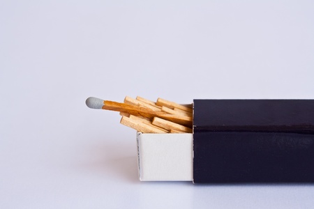 Gray head matches with box on white backgroundの写真素材