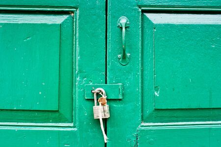 Green door locked の写真素材