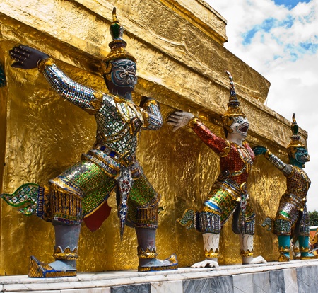 Giant guardians on base of pagoda,Wat Phra Kaew, Thailandの写真素材