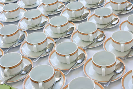 Many rows of coffee cup and saucer with teaspoonの写真素材