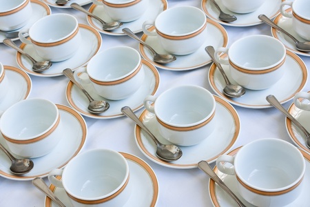Many rows of coffee cup and saucer with teaspoonの写真素材