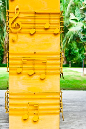 Yellow musical notes on the yellow poleの写真素材