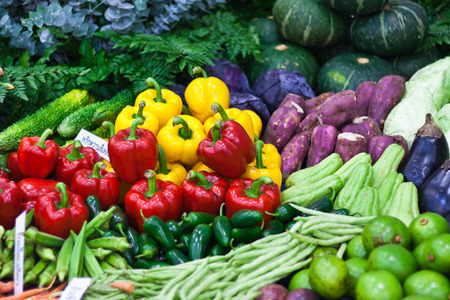 Ripe Yellow, Red and Green Peppers in Vegetables Marketの写真素材