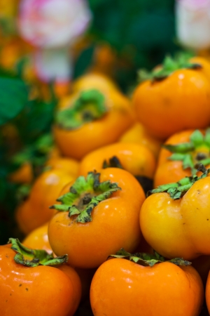 Group of Persimmon fruit background in Vegetables Marketの写真素材