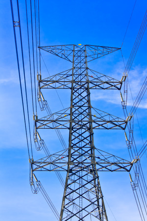 Electricity pylons with long cable at dayの写真素材
