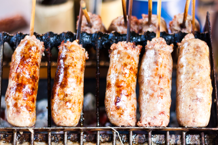 Skewered vermicilli sausages tradtional thai street foodの写真素材