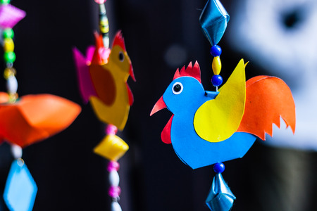 cute handicraft chicken mobile made from colored paperの写真素材