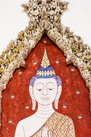 Buddha paintings on concrete boardの写真素材