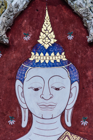 Buddha paintings on concrete boardの写真素材