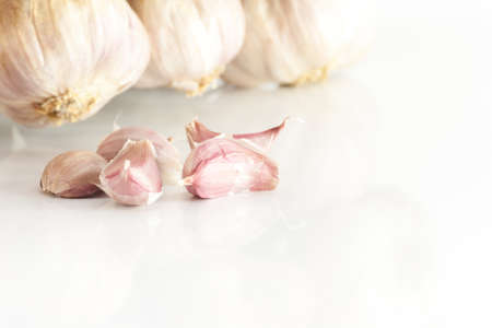 White garlic texture. Fresh garlic closeup. Spicy cooking ingredient picture. White garlic head heap and Garlic clovesの写真素材