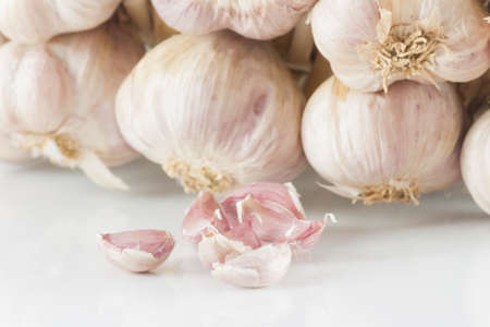 White garlic texture. Fresh garlic closeup. Spicy cooking ingredient picture. White garlic head heap and Garlic clovesの写真素材