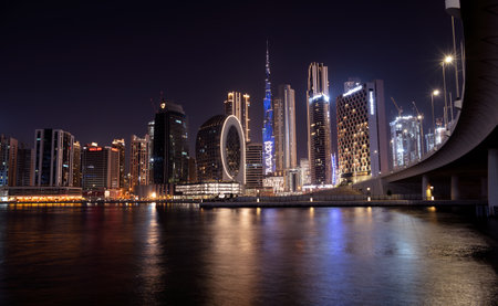 March 5th,2021, Dubai,UAE. Beautiful view of the illuminated sky scrappers along with Burj khalifa captured from the Marasi drive at the Business bay district, Dubai, UAE.のeditorial素材